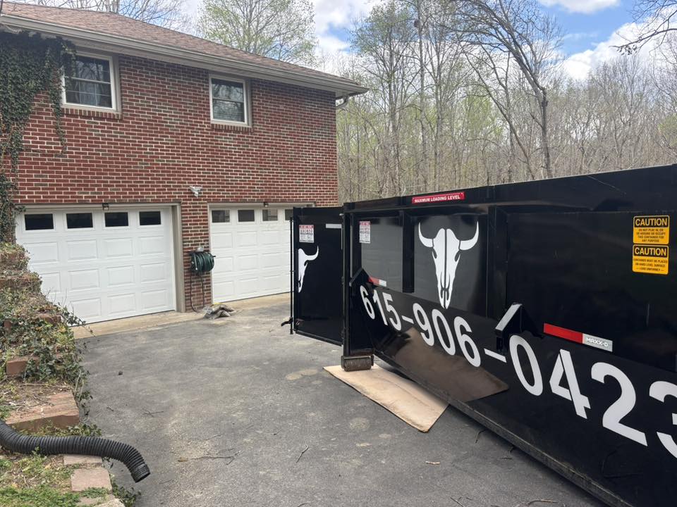 Dumpsteer dumpster at a driveway